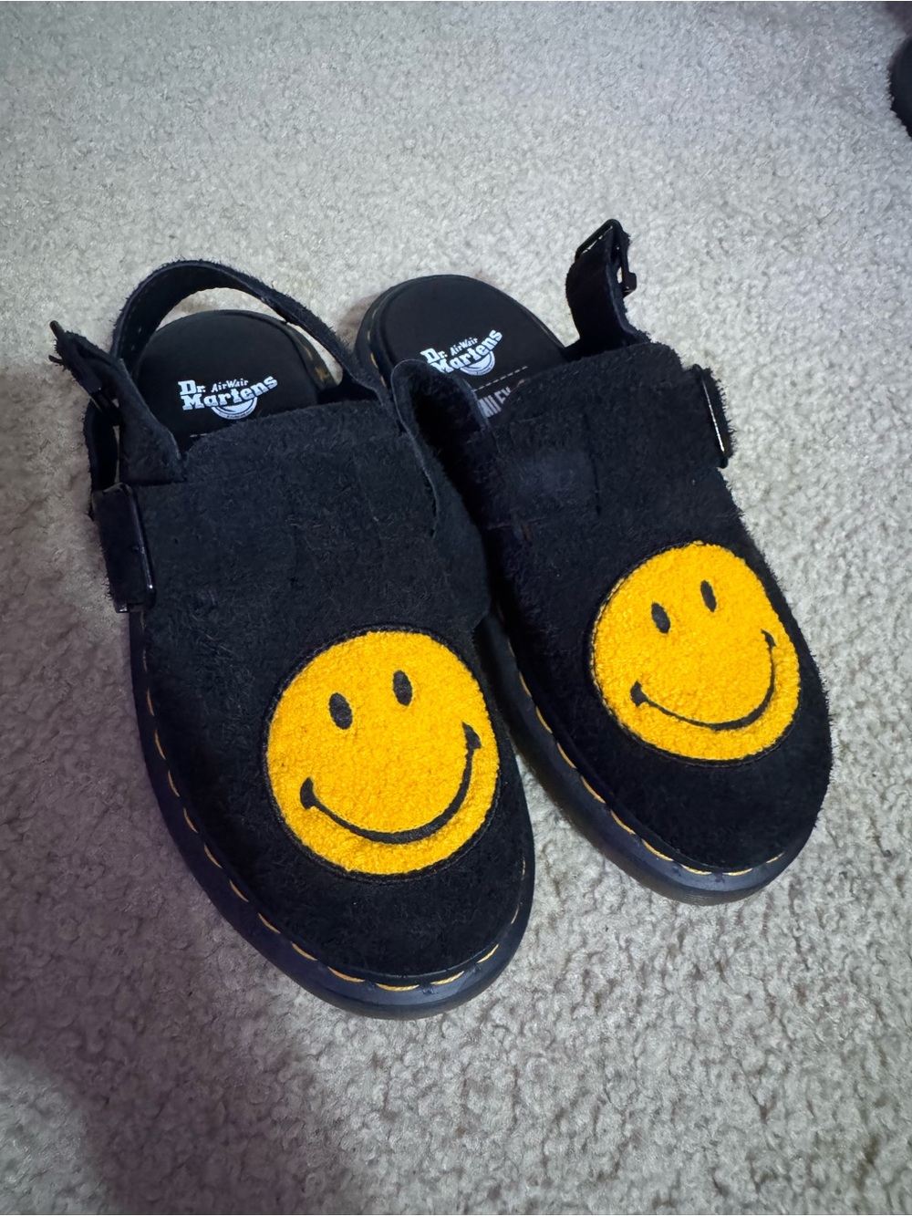 Dr. Martens Black Suede Smiley Clog Mules with Yellow Patch